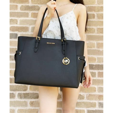 michael kors draw string purses|Michael Kors saffiano leather tote.